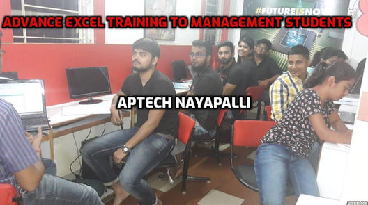 Data analytics students attending an advanced Excel class and practicing data analysis techniques.