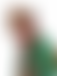 Jerome, a french hunter dressed with a green jaquet, a red neck scarf, a hat, and a shotgun