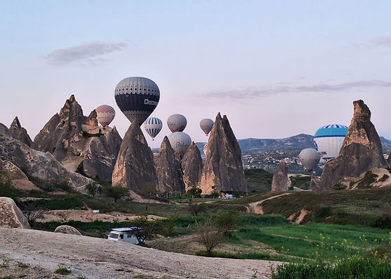 Hot air balloons in rocky landscape