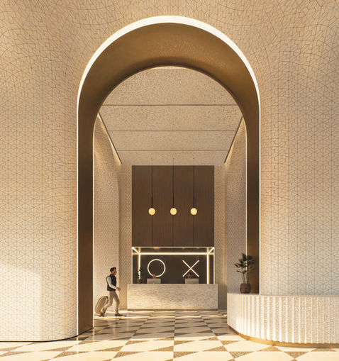 Elegant lobby with archway and checkered floor.
