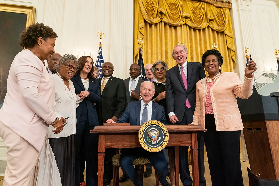 President Biden turns Juneteenth into a federal Thing. Don’t they all look so pleased with themselves? Uh, yay? Photo by The White House - P20210608CW-1394, Public Domain