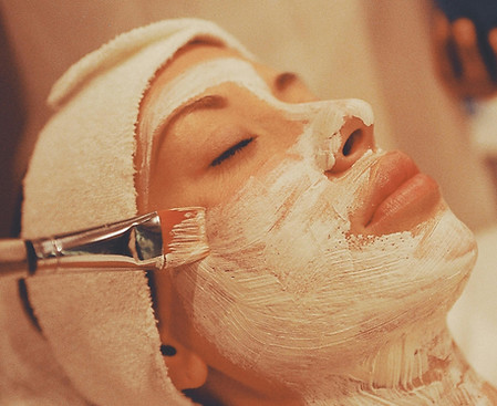 Relaxing facial treatment with skincare application in a spa setting
