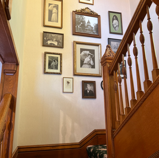 Staircase with historic photos on the wall