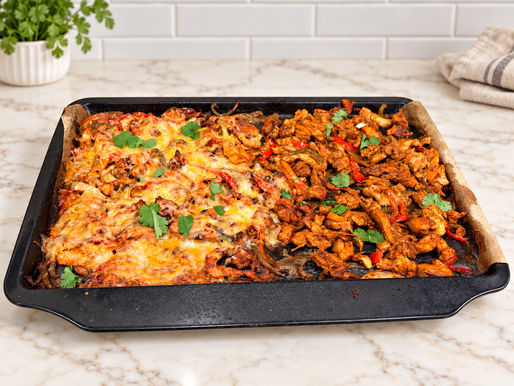 One-pan cheesy chicken fajitas with colorful bell peppers onions homemade pico de gallo and creamy pepper jack queso