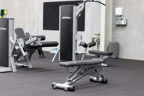 Various benches and machines for fitness at Align Functional Fitness