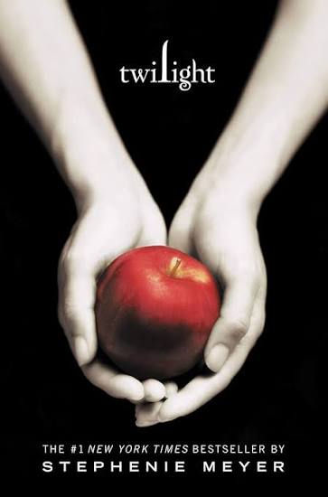 Front cover of "Twilight" by Stephanie Meyer. Cover depicts two hands holding an apple against a plain black background.