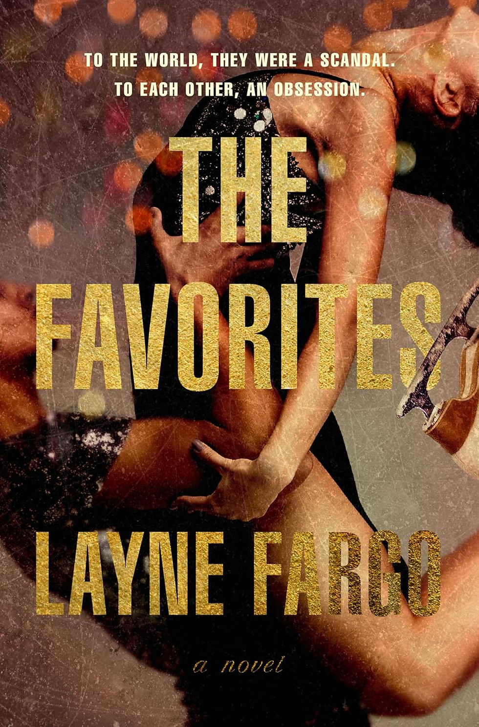 Two entwined bodies against a bokeh background with bold gold text: "The Favorites" by Layne Fargo. Mood: Passionate and intense.