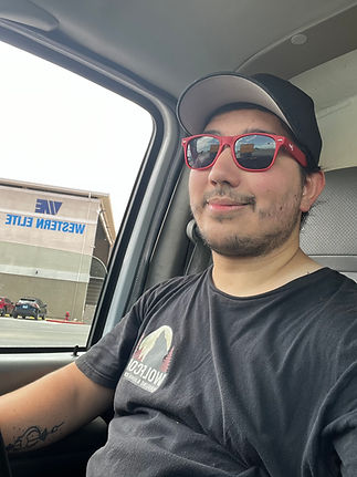 Mike, owner of Wolfcore Hauling & Junk Removal, wearing his company uniform at a local disposal site in Henderson, Nevada