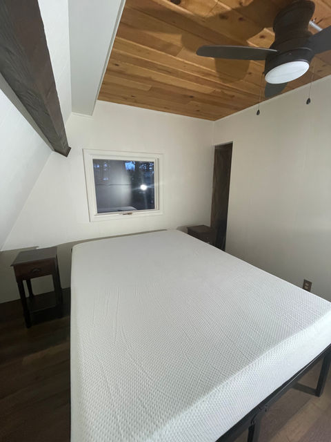 After - Wood Paneling Painted White, Beams Stained Dark Brown