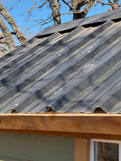 My panels have a small overlap, and stop right at the edge of the decking. 