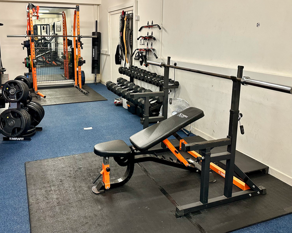 Incline bench press and squat rack in Yorkshire Kettlebell Club gym.