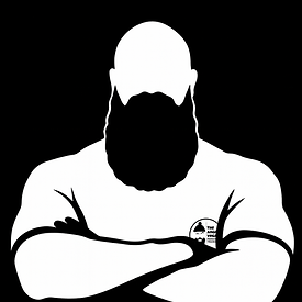 Illustration of Liam with arms folded, bearded and muscular, wearing an Angry Vegan t-shirt. Represents one-to-one old-school strength training for men 35+.