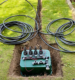 Automated control valves with piping dug into the lawn