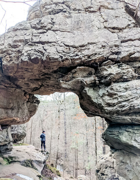 Person standing on cliff at Seven Hollows
