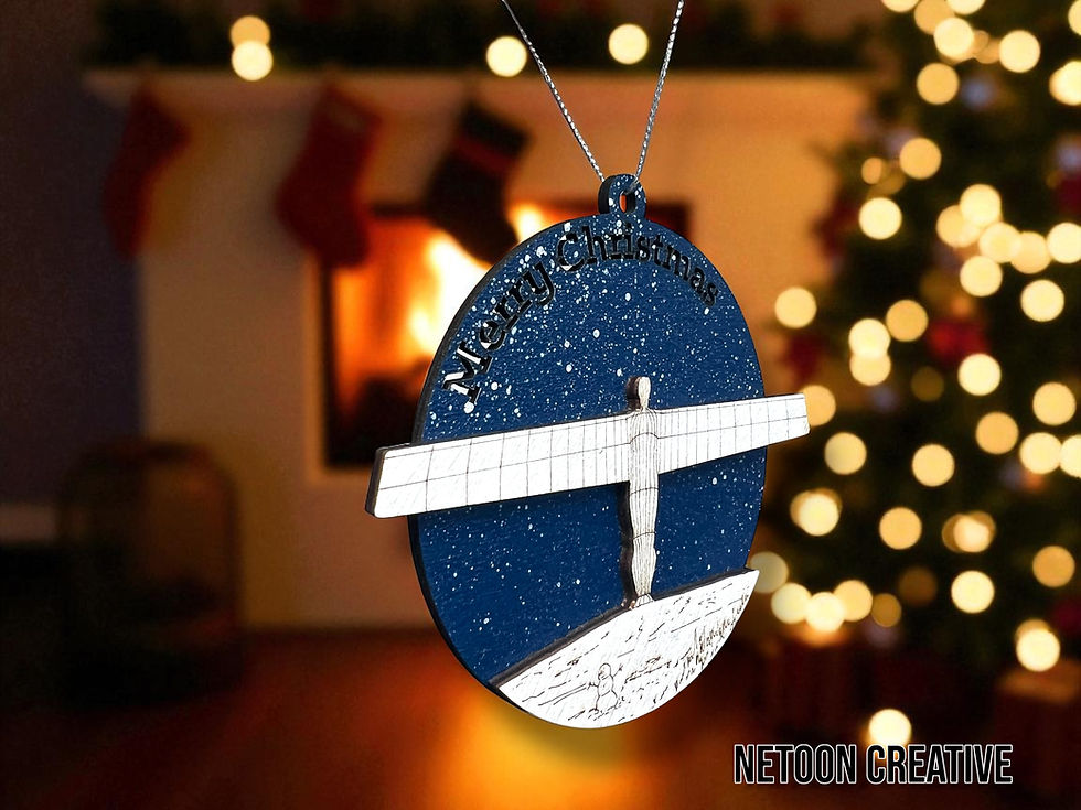 Angel of the North Christmas bauble hanging on a tree in a cozy living room, showing side detail.