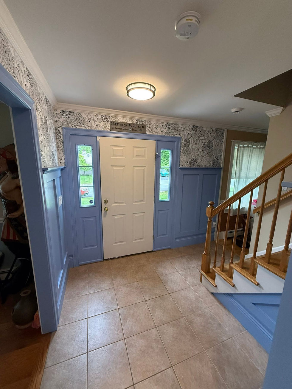 Finish trim work with new door and wallpaper installation