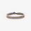 Thumbnail: dreireihiger armband aus Messingmuttern und Stahlmuttern auf weissem Hintergrund