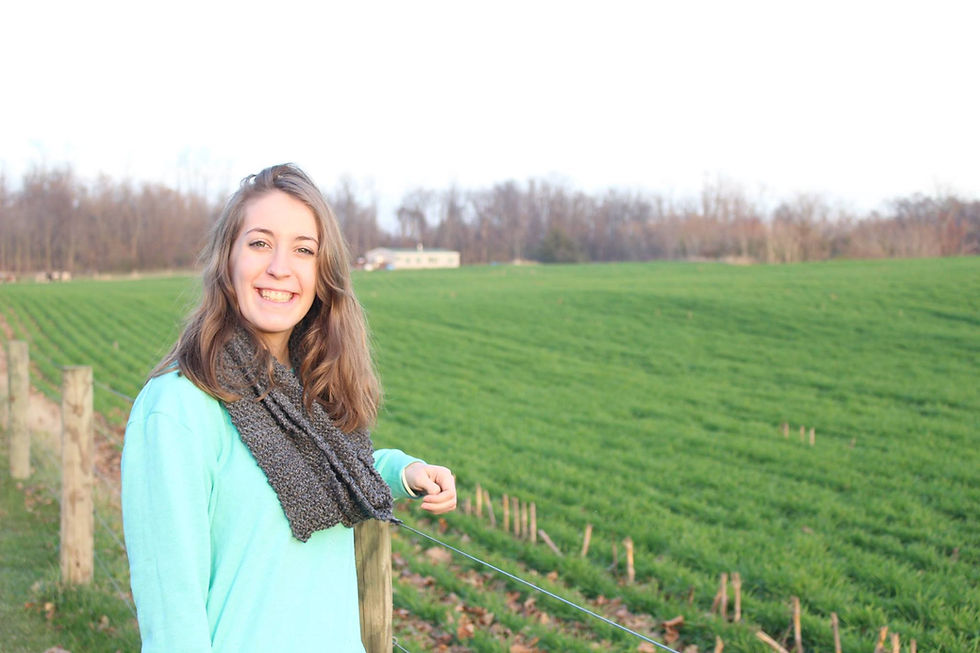 Kirsten Gollier standing next to a field of grass in Pennsylvania
