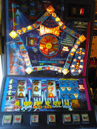Maygay Gladiators fruit machine with blue artwork, three reels and a feature trail around a circular centre display