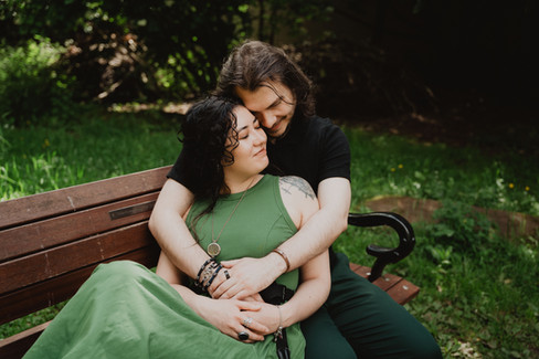 Couple cuddling on bench in Clifton gardens | Bristol Wedding Photographer