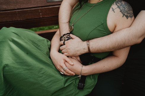 Couple cuddling on bench in Clifton gardens | Bristol Wedding Photographer