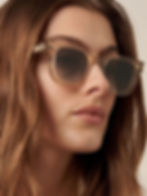 Woman wearing stylish brown sunglasses