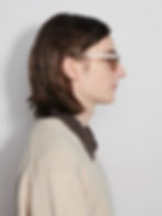Man in profile wearing brown sunglasses