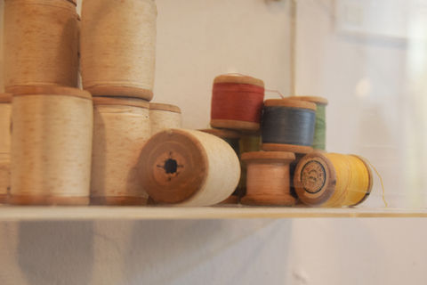 Wooden spools of colorful threads