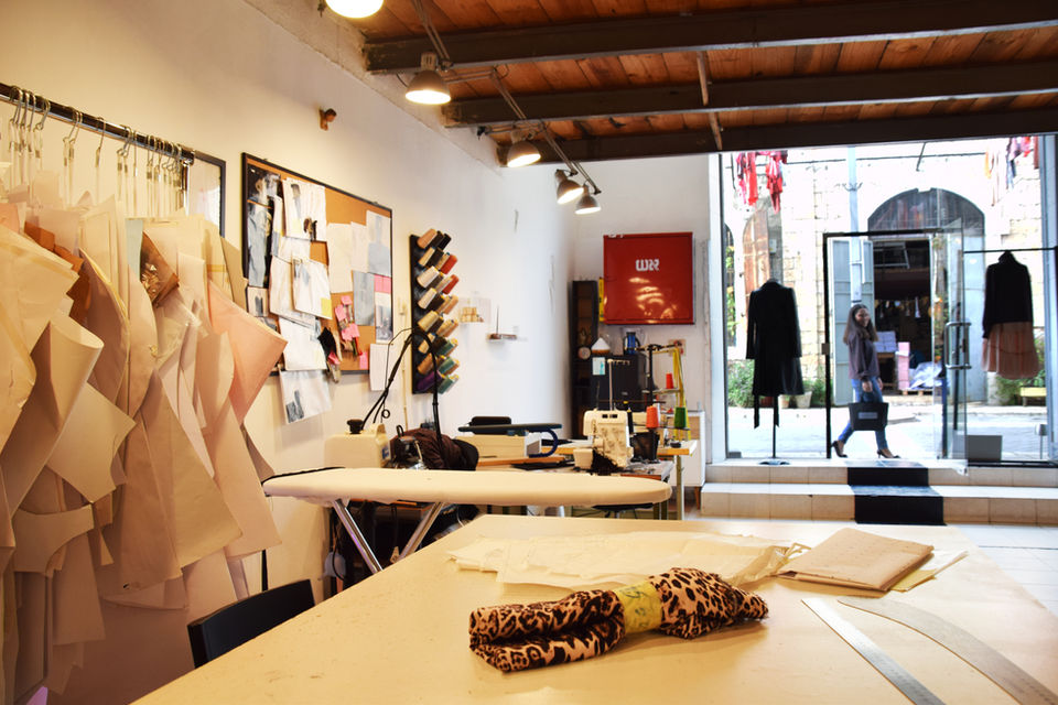 Fashion design studio: sewing patterns, fabrics, and tools