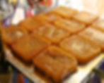 A tray of Spanish dessert Torrijas. Golden brown slices of sugary bread.