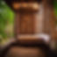 a wooden thai massage bed with a rain forest outside the room