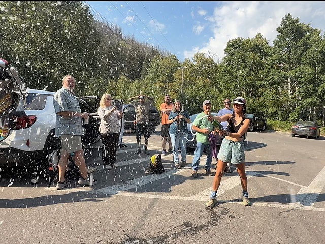 thru-hiker celebrating the end of the Continental Divide Trail