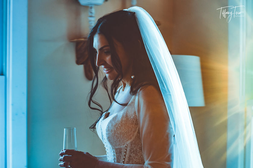 Bride with white veil getting ready at Cabin Heaven