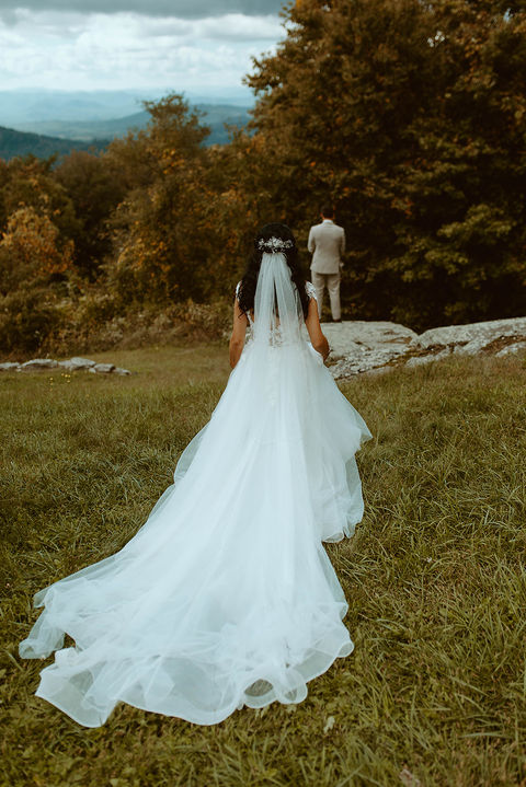 Bride and groom sharing their first look at Cabin Heaven wedding venue in the Blue Ridge Mountains.