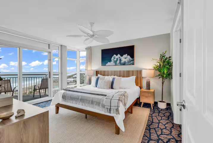 Eye-level view of a well-maintained vacation rental home with a clean porch and inviting entrance
