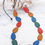 Thumbnail: Suzie Blue Painted Wood Pebble Necklace