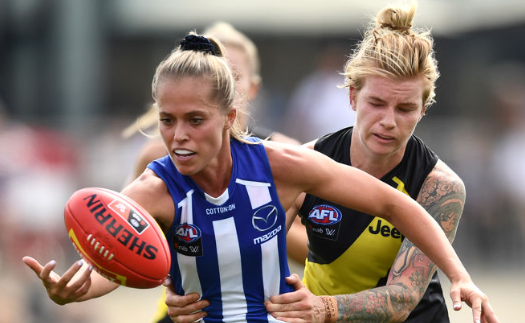 Phoebe Monahan tackles an opponent
