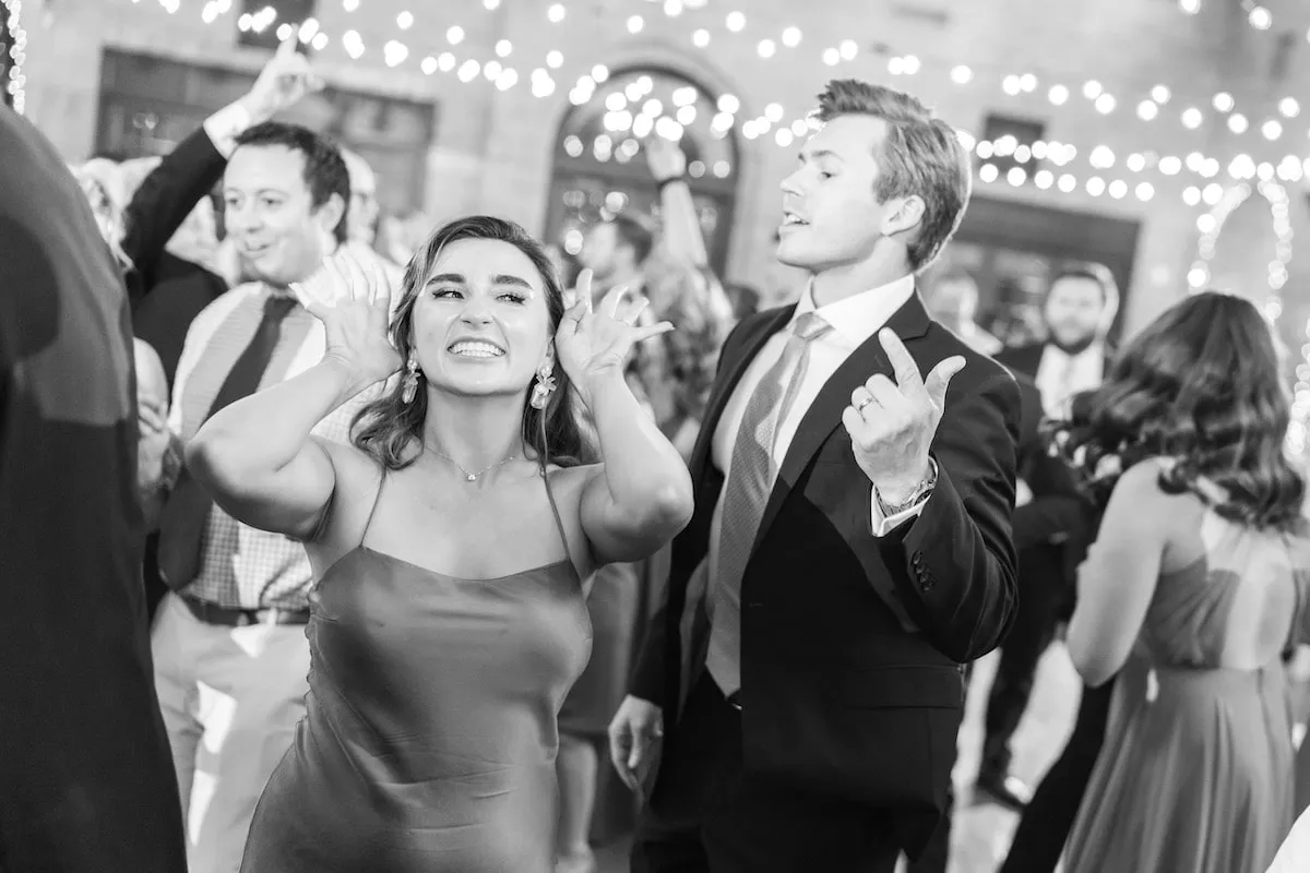 woman and man dancing at wedding
