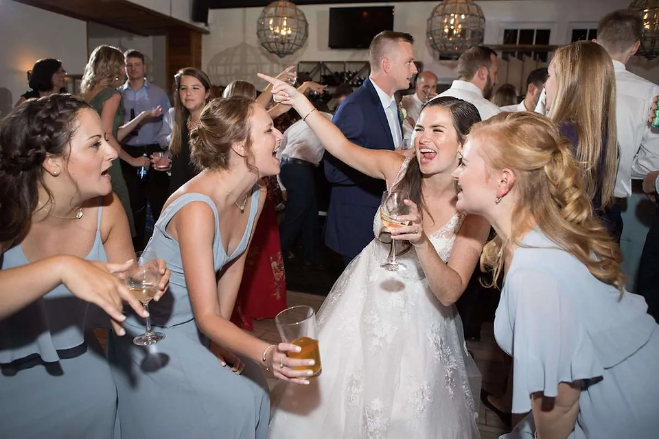 bride dancing with bridesmaids