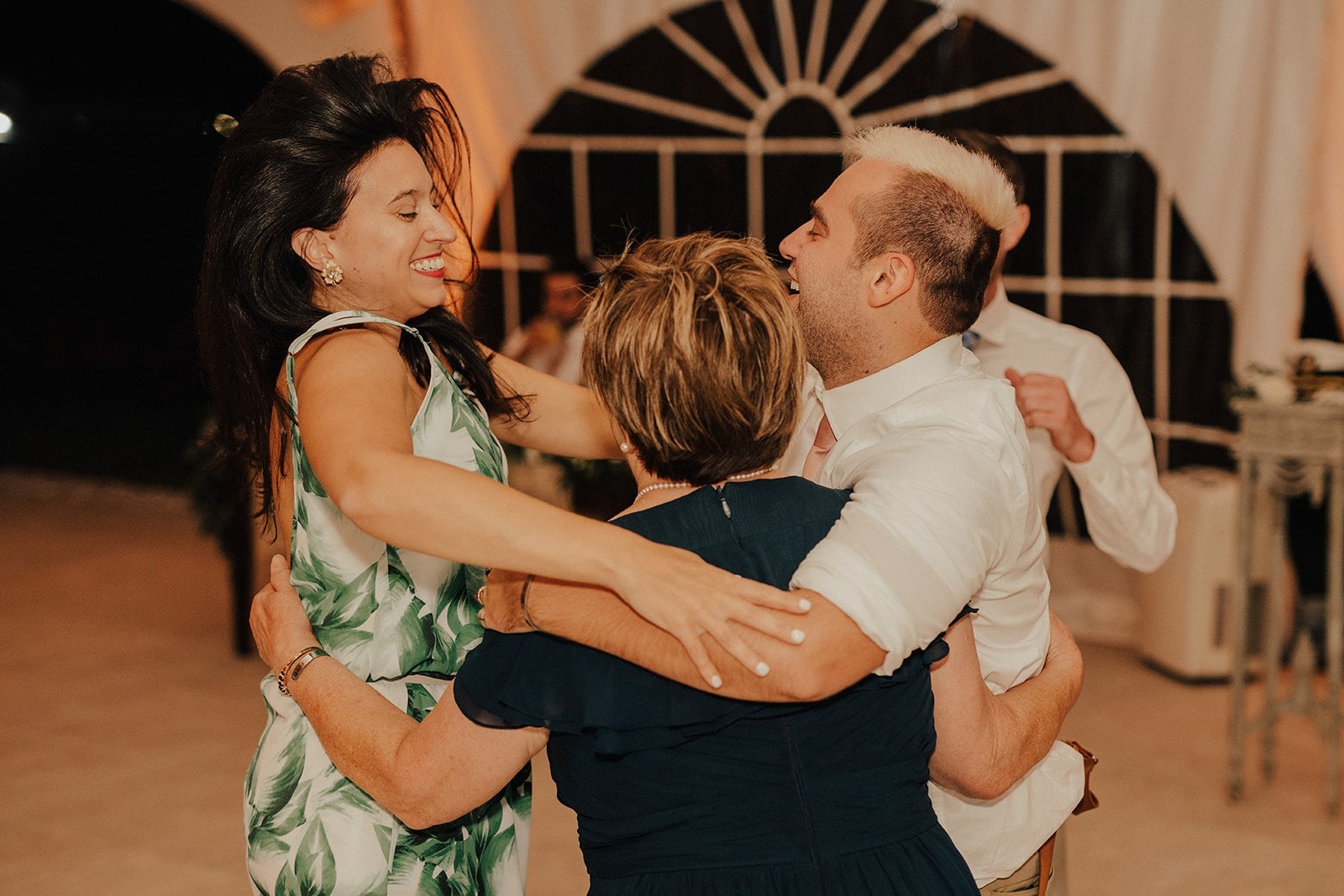 guests hug and dance