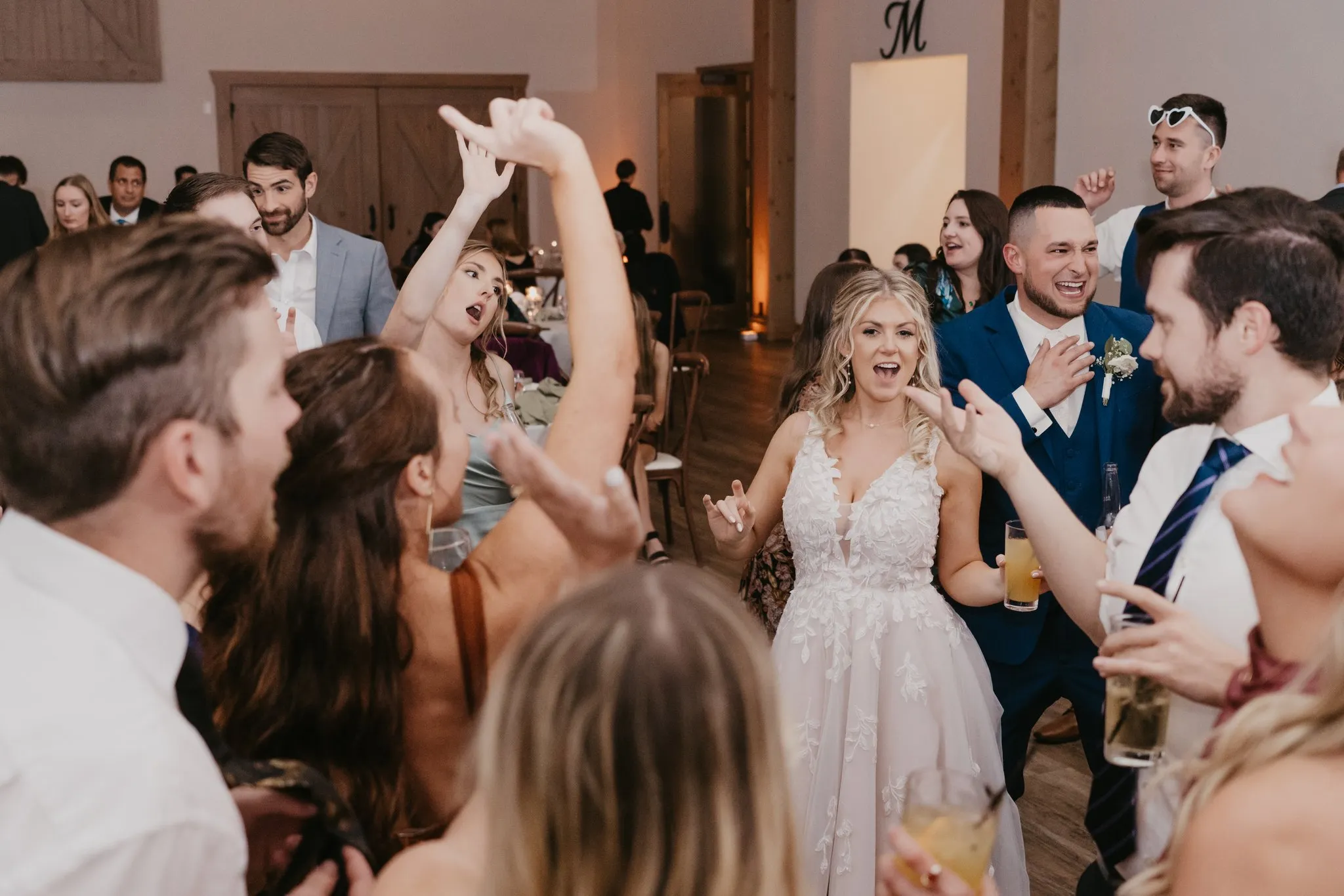 bride and groom dancing with guests