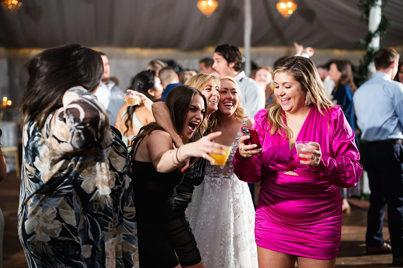 women dancing with bride