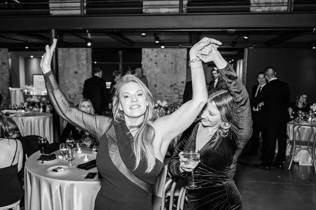 two women dancing at wedding