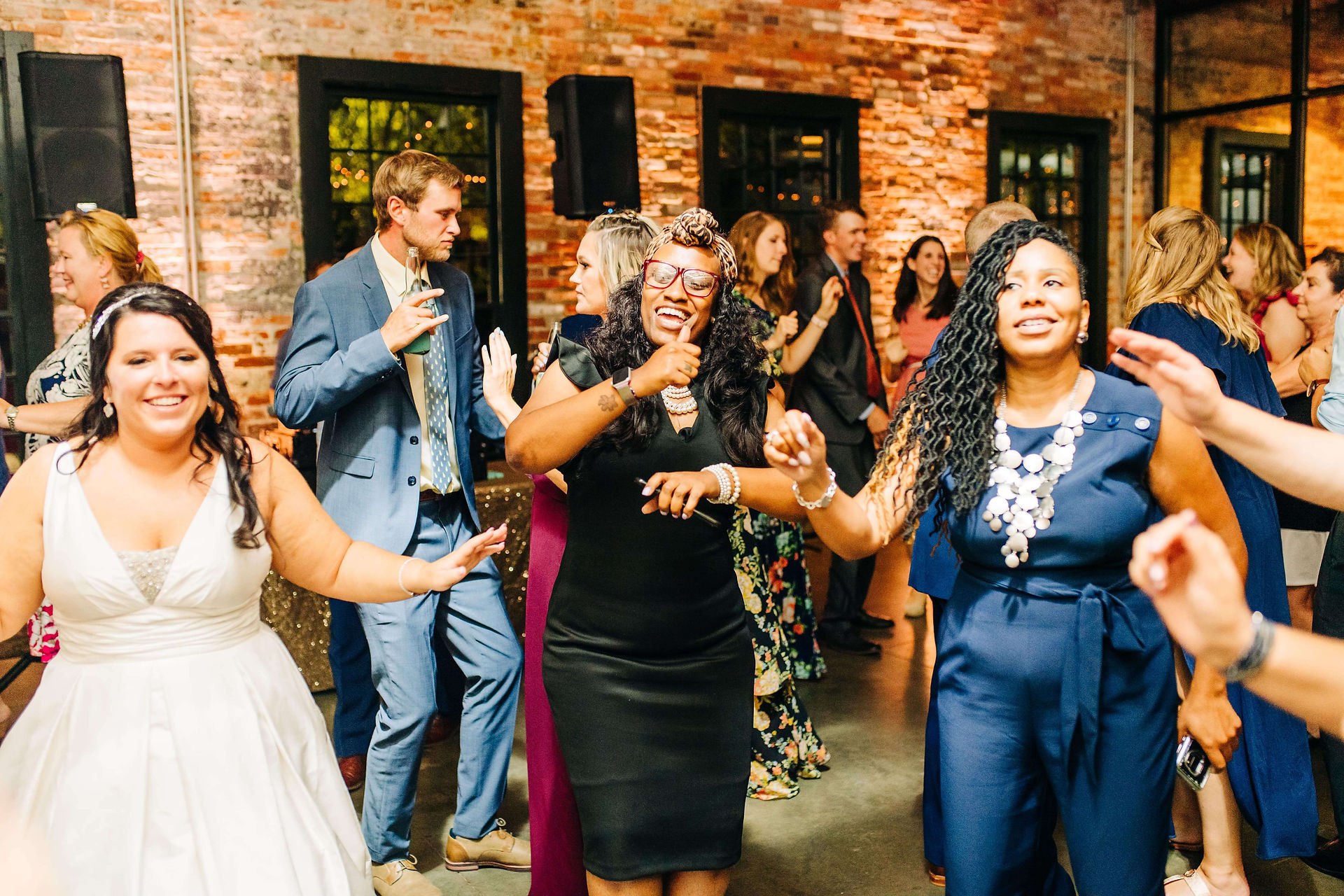 bride and guests dancing