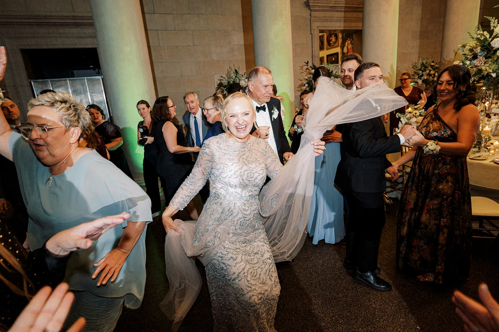 bride dancing at wedding with guests