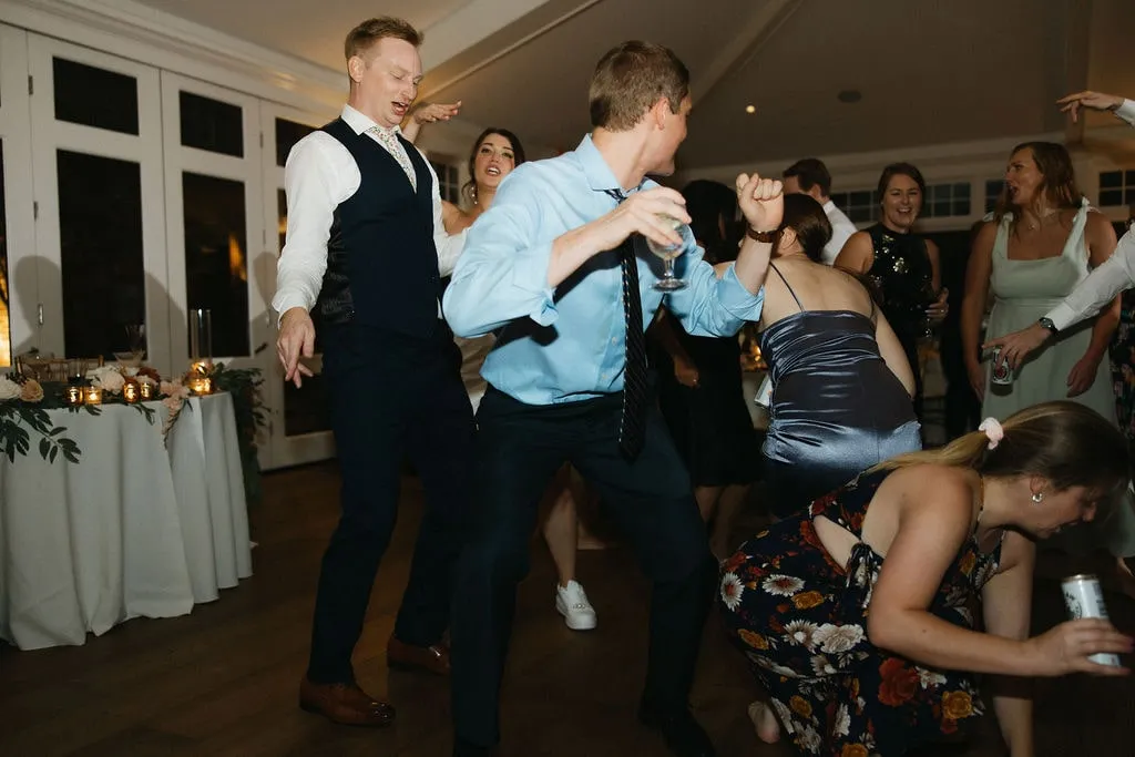 guests dancing wildly at wedding