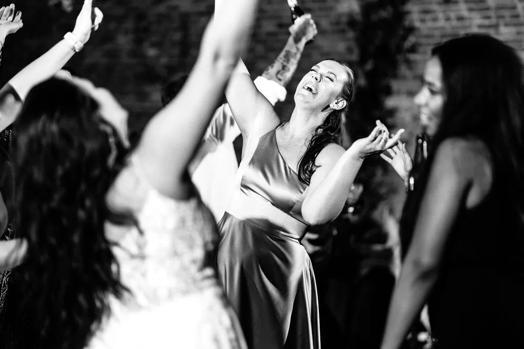 bridesmaid dancing while smiling