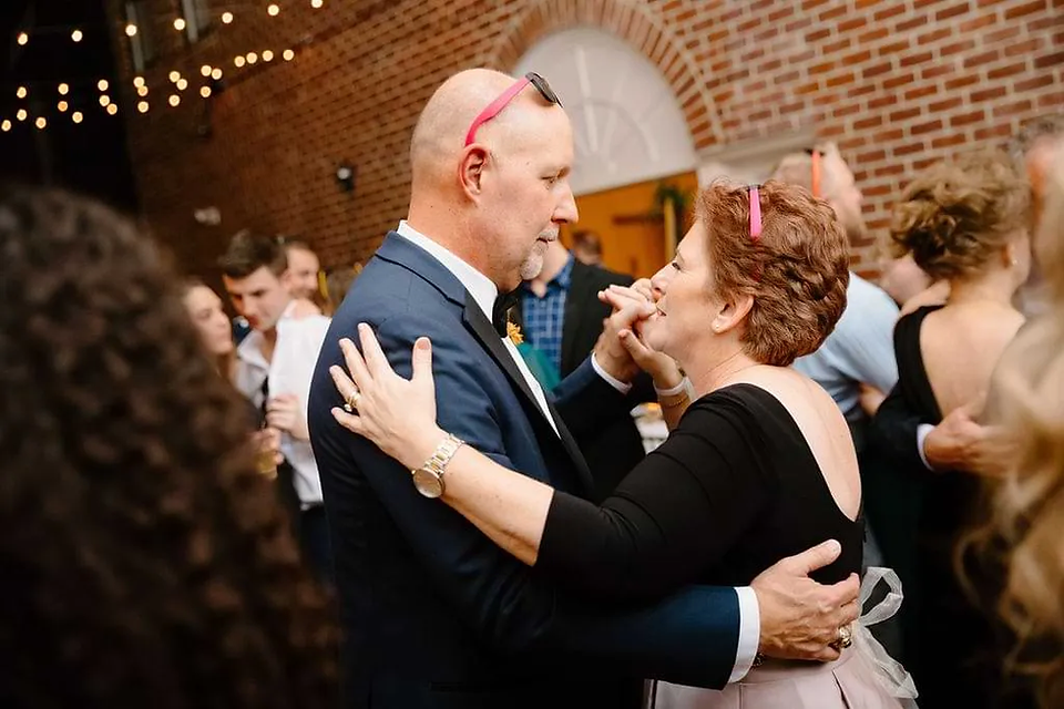 older couple slow dancing at wedding