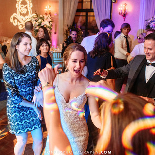 bride groom and guests dance at wedding