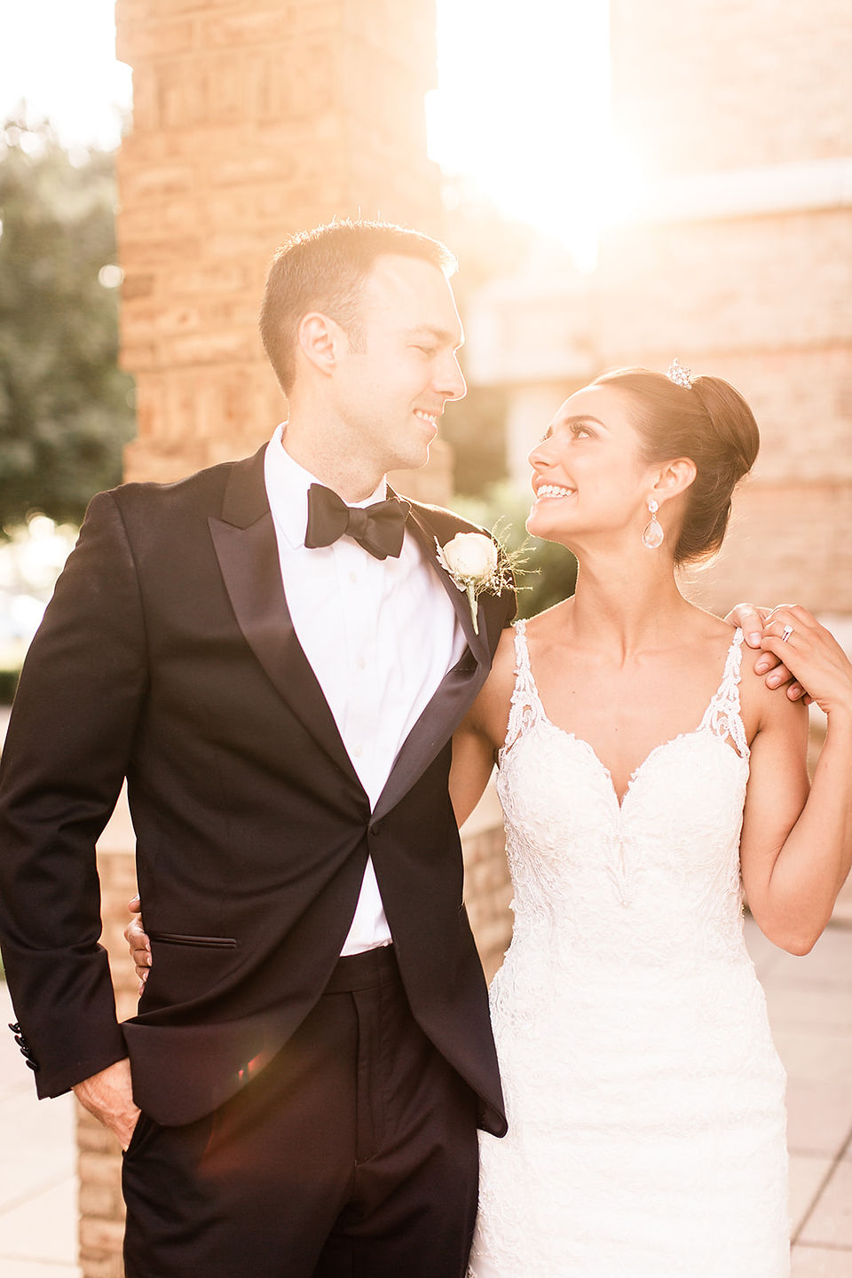 bride and groom looking at each other during golden hour